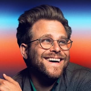 Headshot of Adam Conover